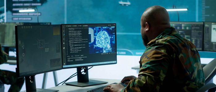 Cloud computing expert using new technology AI brain to learn intelligence for national defense missions, operating laptop to gather information from cctv systems. Neural network. Camera A.
