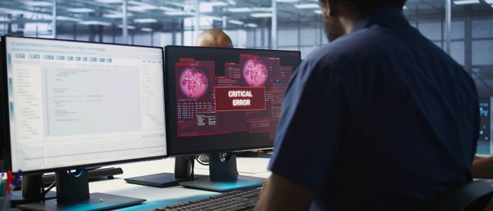 Cybersecurity division workers in server room protecting equipment from hacker stealing data. Data center IT specialists struggling to delete virus attacking company servers, doing brainstorming